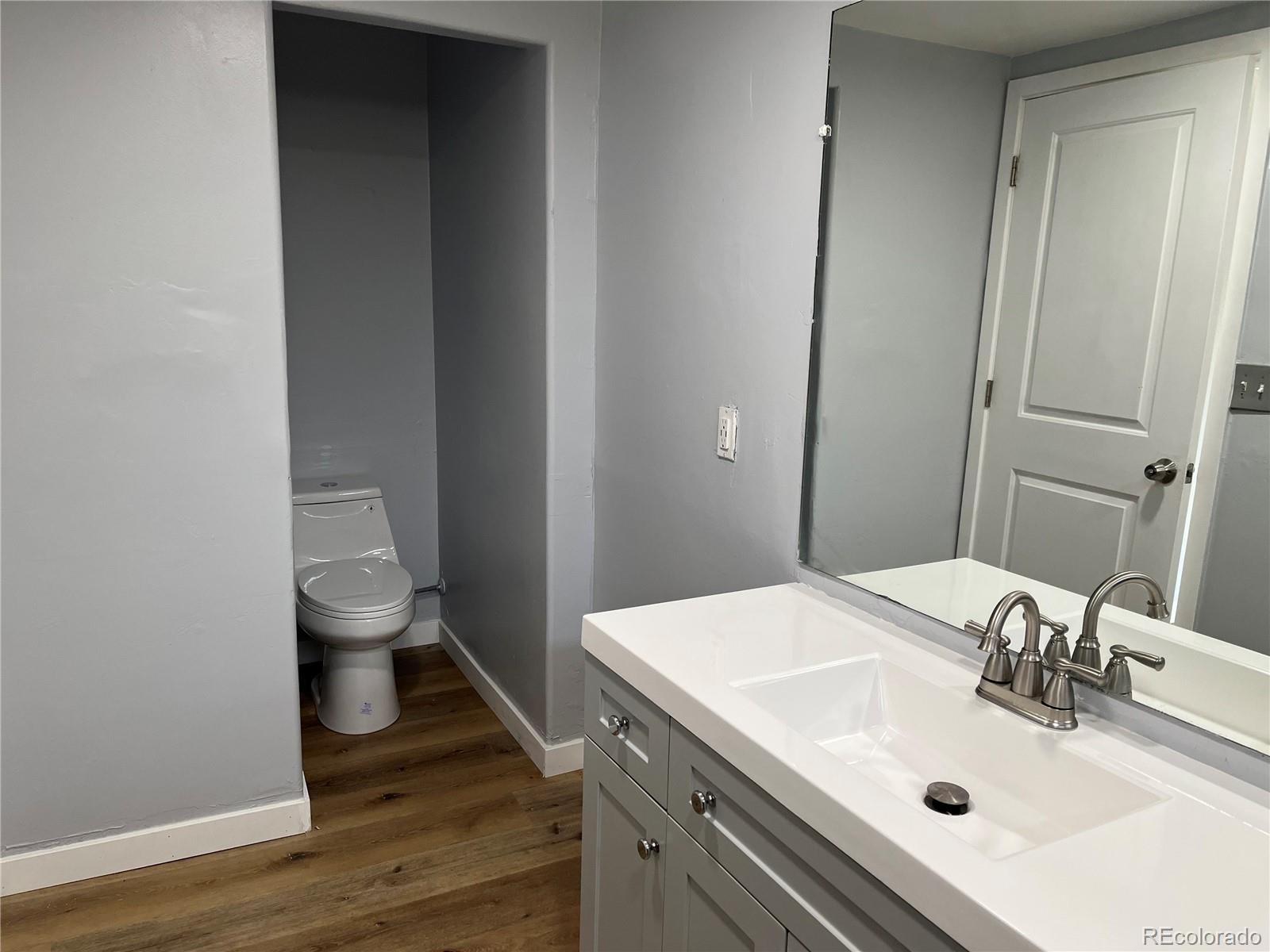 4315 Balsam Street, Unit A Wheat Ridge, CO 80033 - Photo 17 of 21 a bathroom with a sink and a toilet