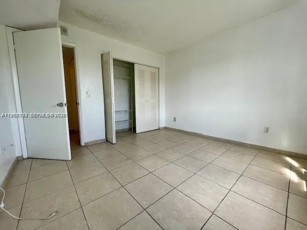 a view of a livingroom and entryway
