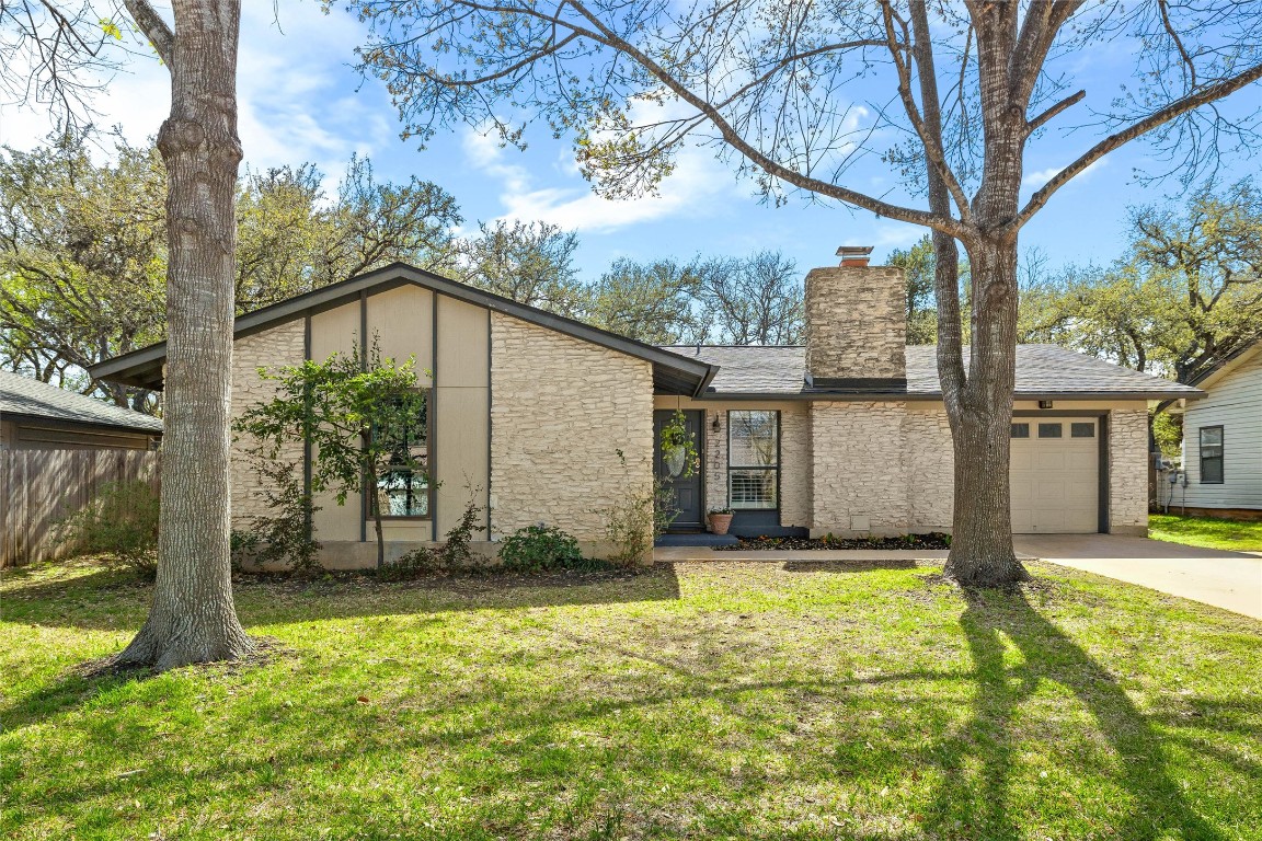 2205 Whitestone Drive Austin, TX 78745 - Photo 1 of 1 a house that has a big yard with large trees