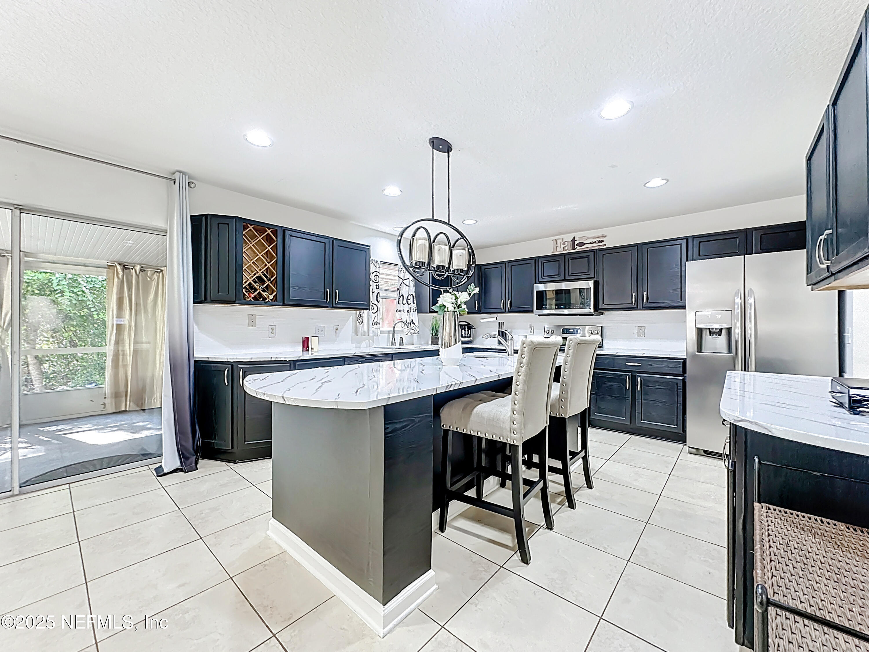 11939 Iron Creek Road Jacksonville, FL 32218 - Photo 17 of 73 a large kitchen with a counter space a sink appliances and cabinets
