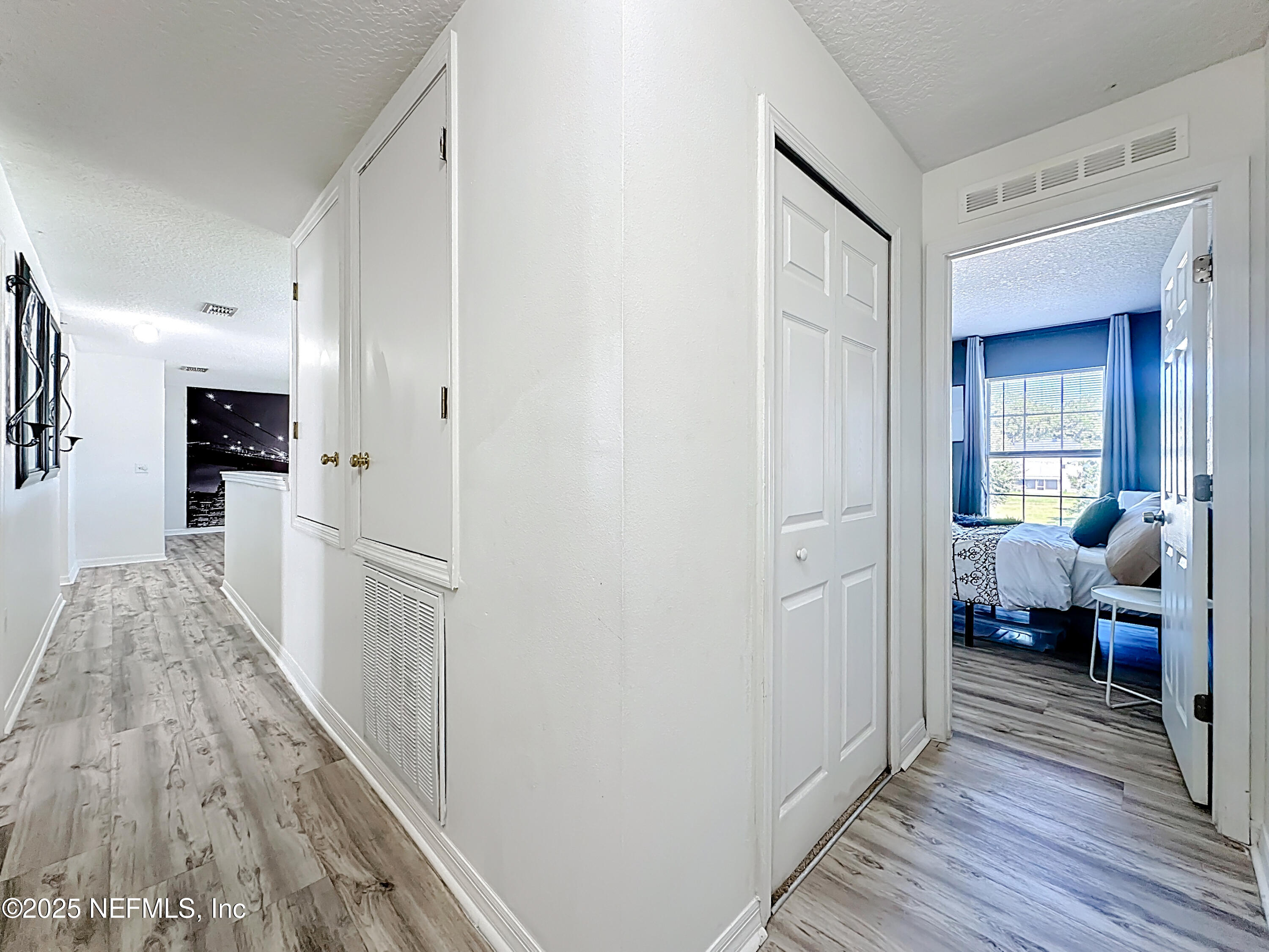 11939 Iron Creek Road Jacksonville, FL 32218 - Photo 33 of 73 a kitchen with a refrigerator and a stove top oven