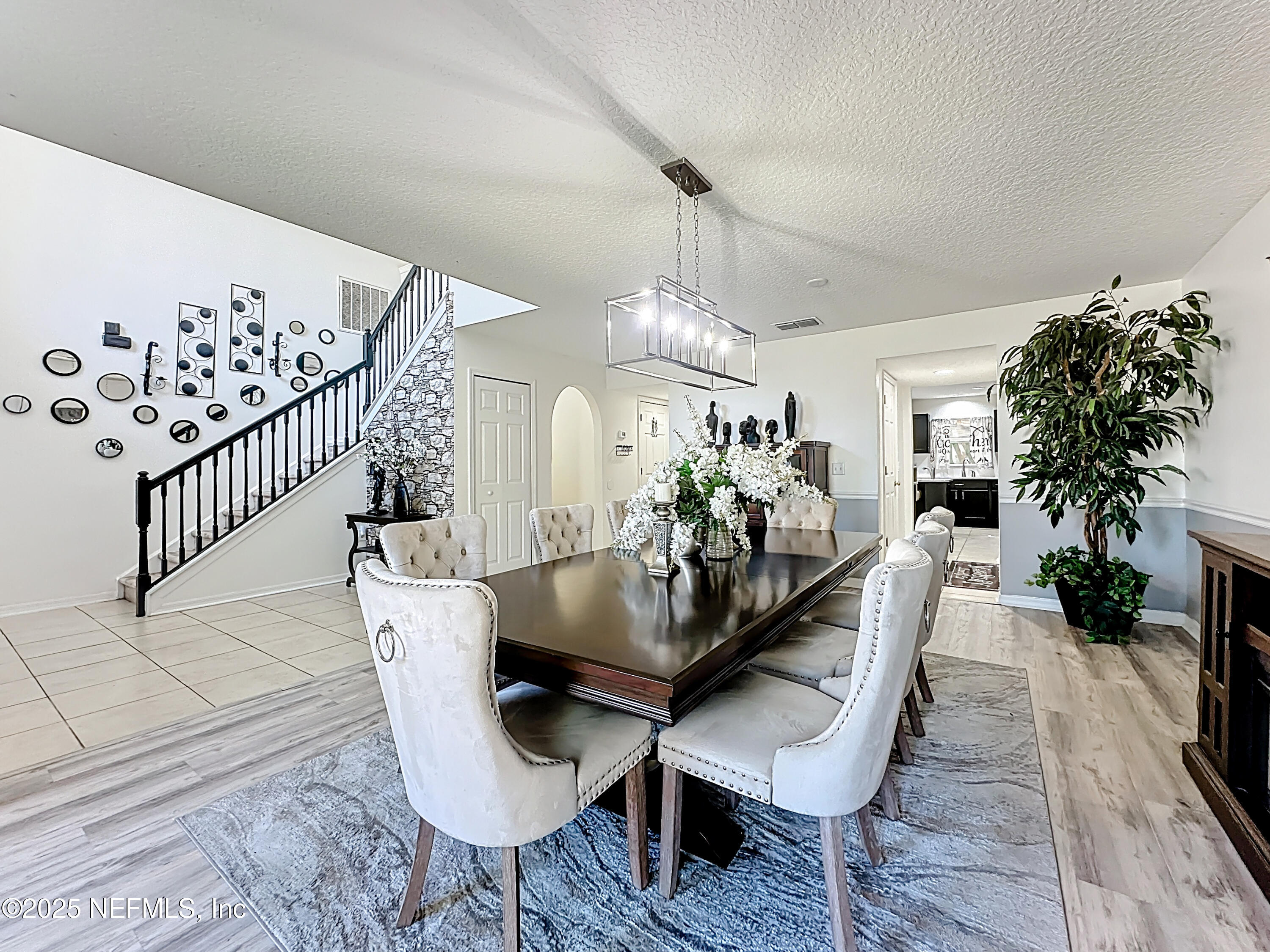 11939 Iron Creek Road Jacksonville, FL 32218 - Photo 9 of 73 a view of a dining room with furniture and wooden floor
