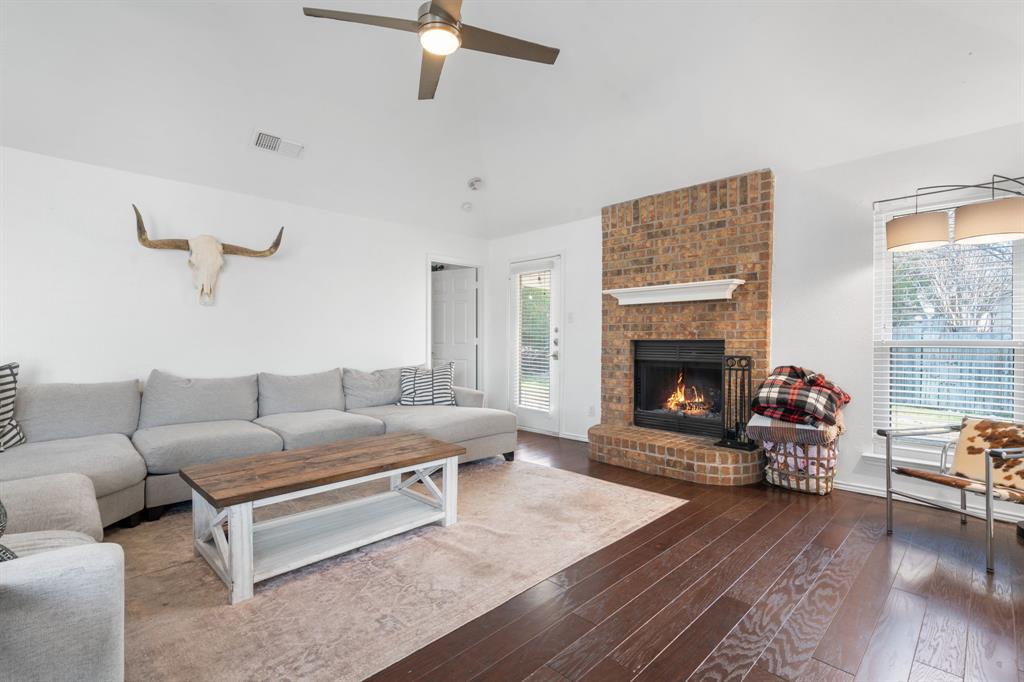 604 Lionel Way Fort Worth, TX 76108 - Photo 11 of 36 a living room with furniture and a fireplace