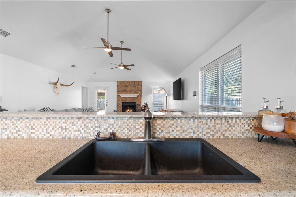 604 Lionel Way Fort Worth, TX 76108 - Photo 16 of 36 a kitchen with a sink and a window