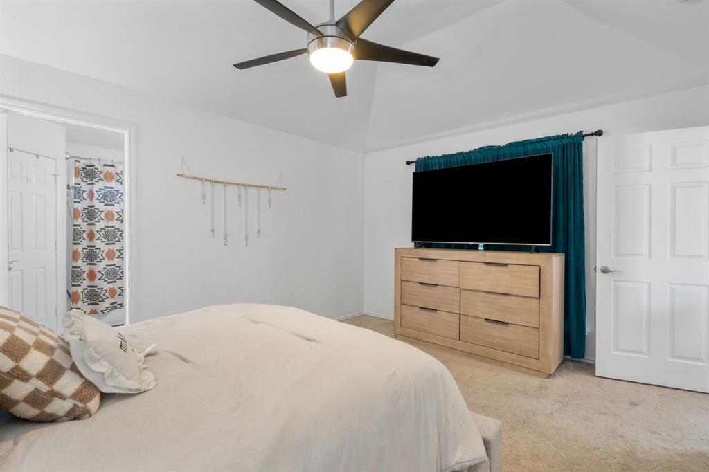 604 Lionel Way Fort Worth, TX 76108 - Photo 24 of 36 a bedroom with a bed tv and a window