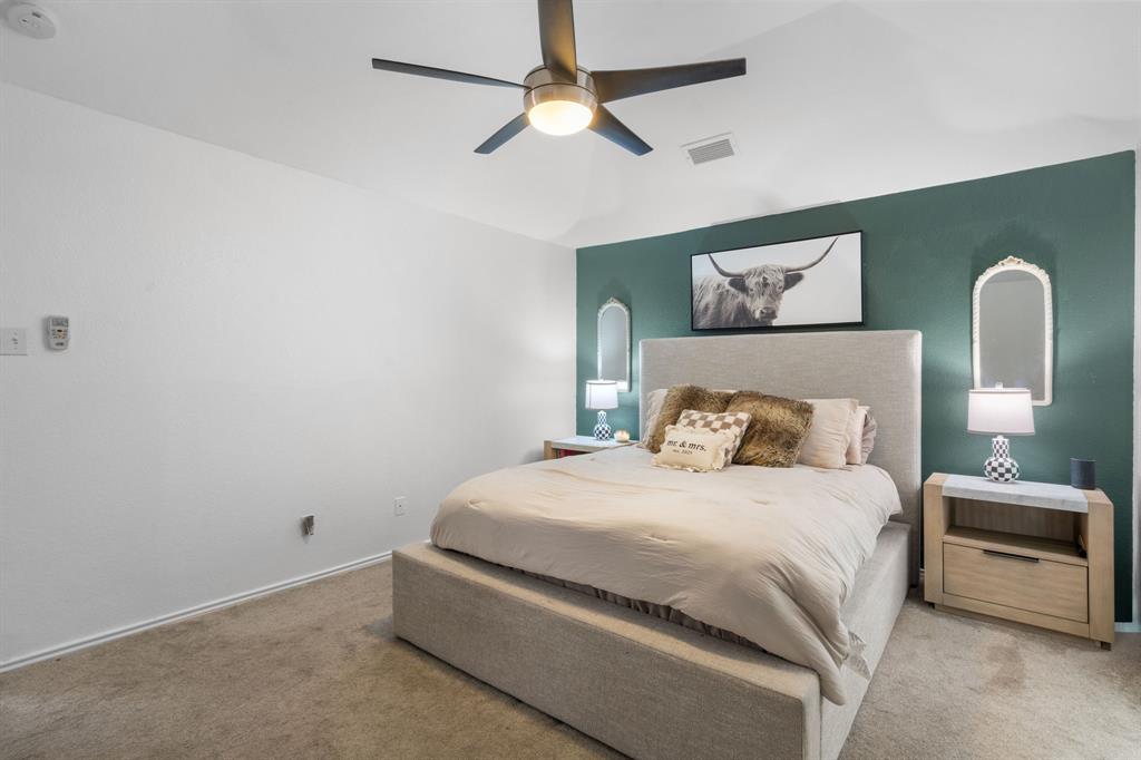 604 Lionel Way Fort Worth, TX 76108 - Photo 25 of 36 a bedroom with a bed and a painting on the wall