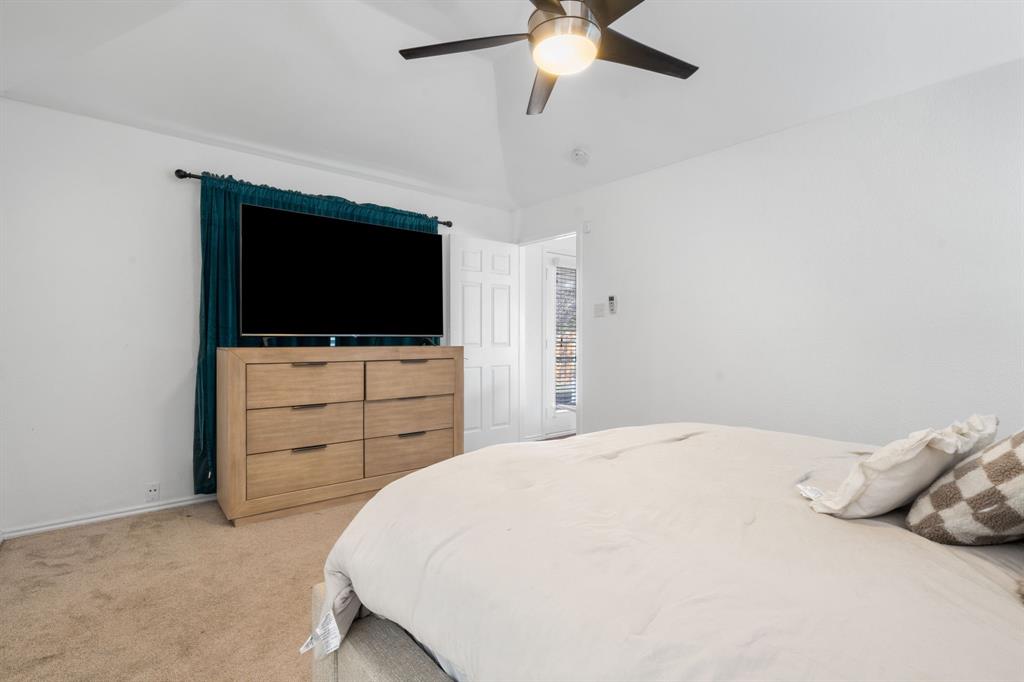 604 Lionel Way Fort Worth, TX 76108 - Photo 26 of 36 a bedroom with a bed and a flat screen tv