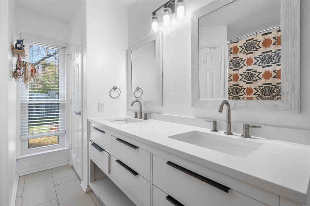 604 Lionel Way Fort Worth, TX 76108 - Photo 27 of 36 a bathroom with a sink and a mirror