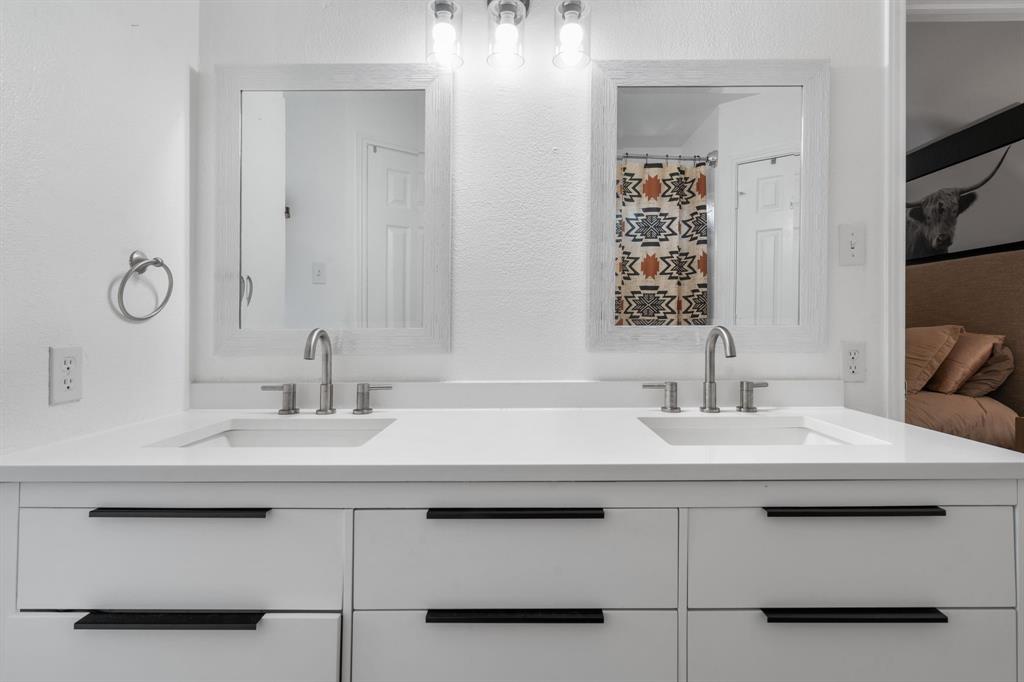 604 Lionel Way Fort Worth, TX 76108 - Photo 28 of 36 a bathroom with a sink and a mirror