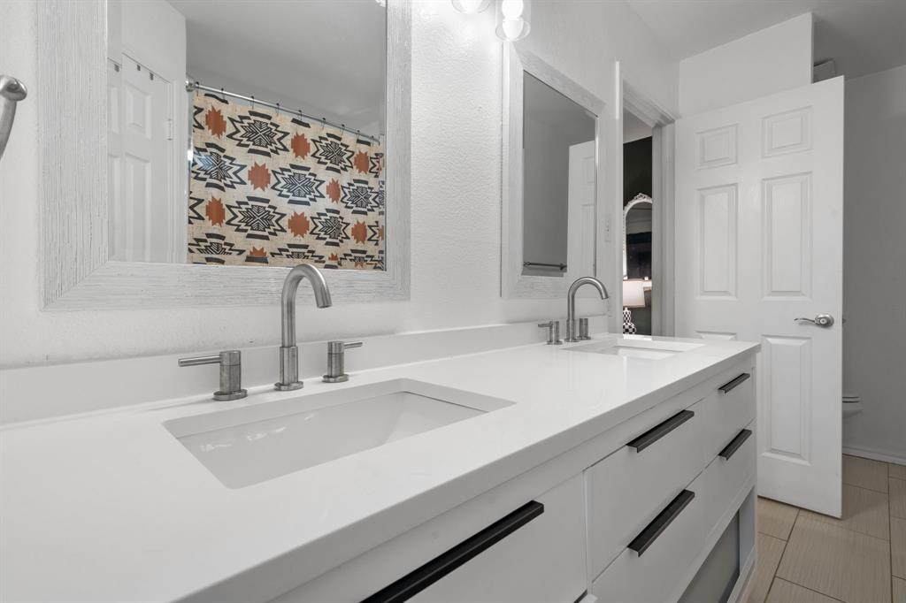 604 Lionel Way Fort Worth, TX 76108 - Photo 29 of 36 a bathroom with a sink and a mirror