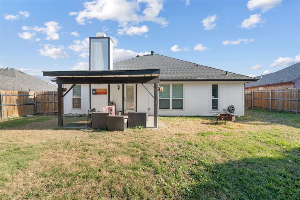 604 Lionel Way Fort Worth, TX 76108 - Photo 35 of 36 a view of a house with backyard outdoor kitchen and patio