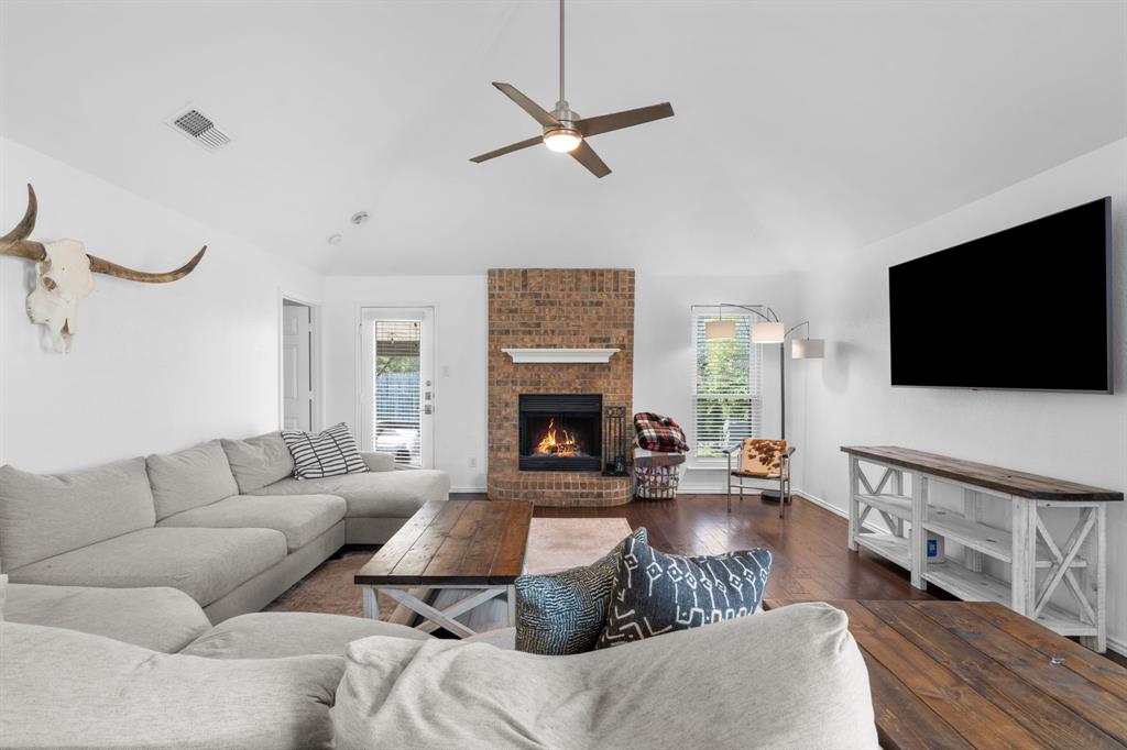 604 Lionel Way Fort Worth, TX 76108 - Photo 7 of 36 a living room with furniture and a flat screen tv