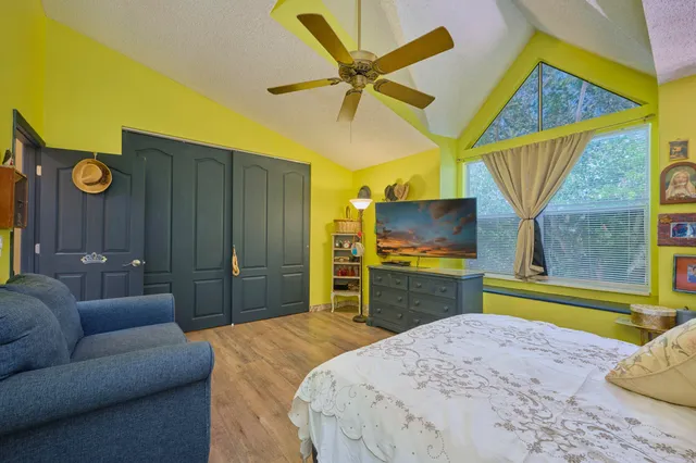 a bathroom with a sink vanity mirror and toilet