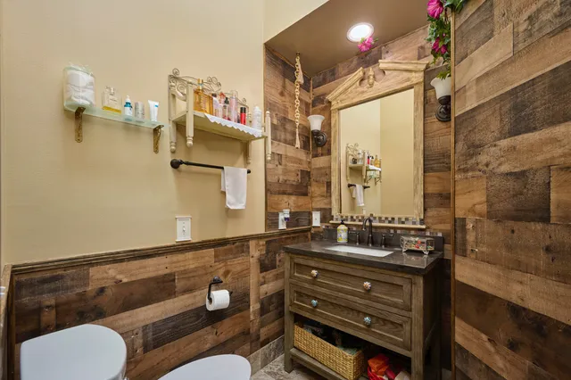 a bedroom with a bed a desk and chair