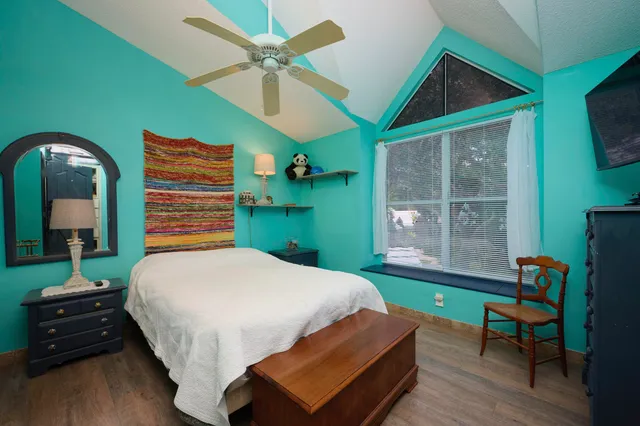 a bedroom with a bed and a dresser