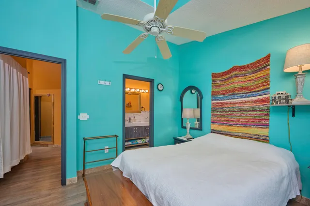 a bedroom with a bed and a dresser