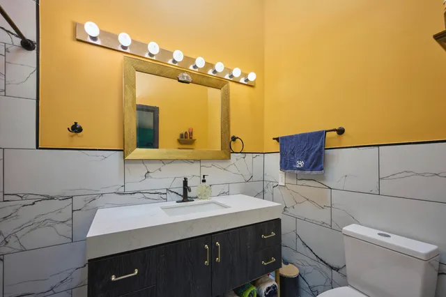 a vase of flowers sitting on a floor