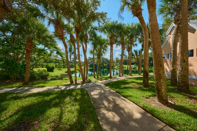 a aerial view of a house with a yard and garden