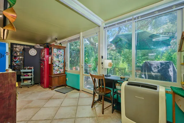 a living room filled with furniture and a book shelf