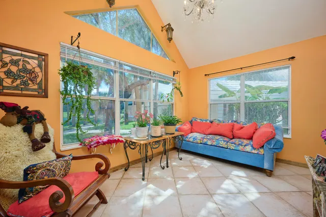 a dining room with furniture and a chandelier
