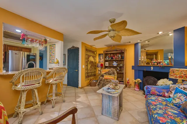 a kitchen with stainless steel appliances granite countertop a refrigerator microwave and sink