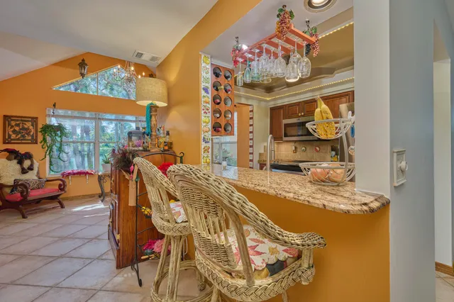 a view of a dining room with furniture window and outside view