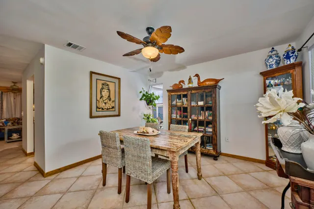 a view of dining room with a table and chairs