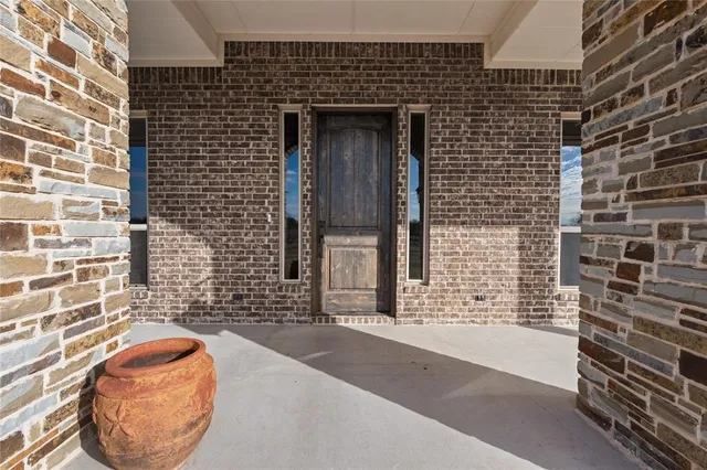a view of hallway with livingroom and furniture