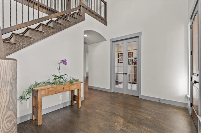a view of a bedroom with painting on the wall