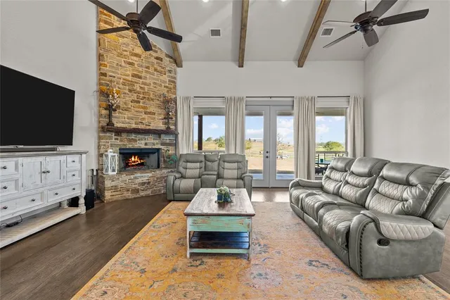 a living room with furniture window and wooden floor