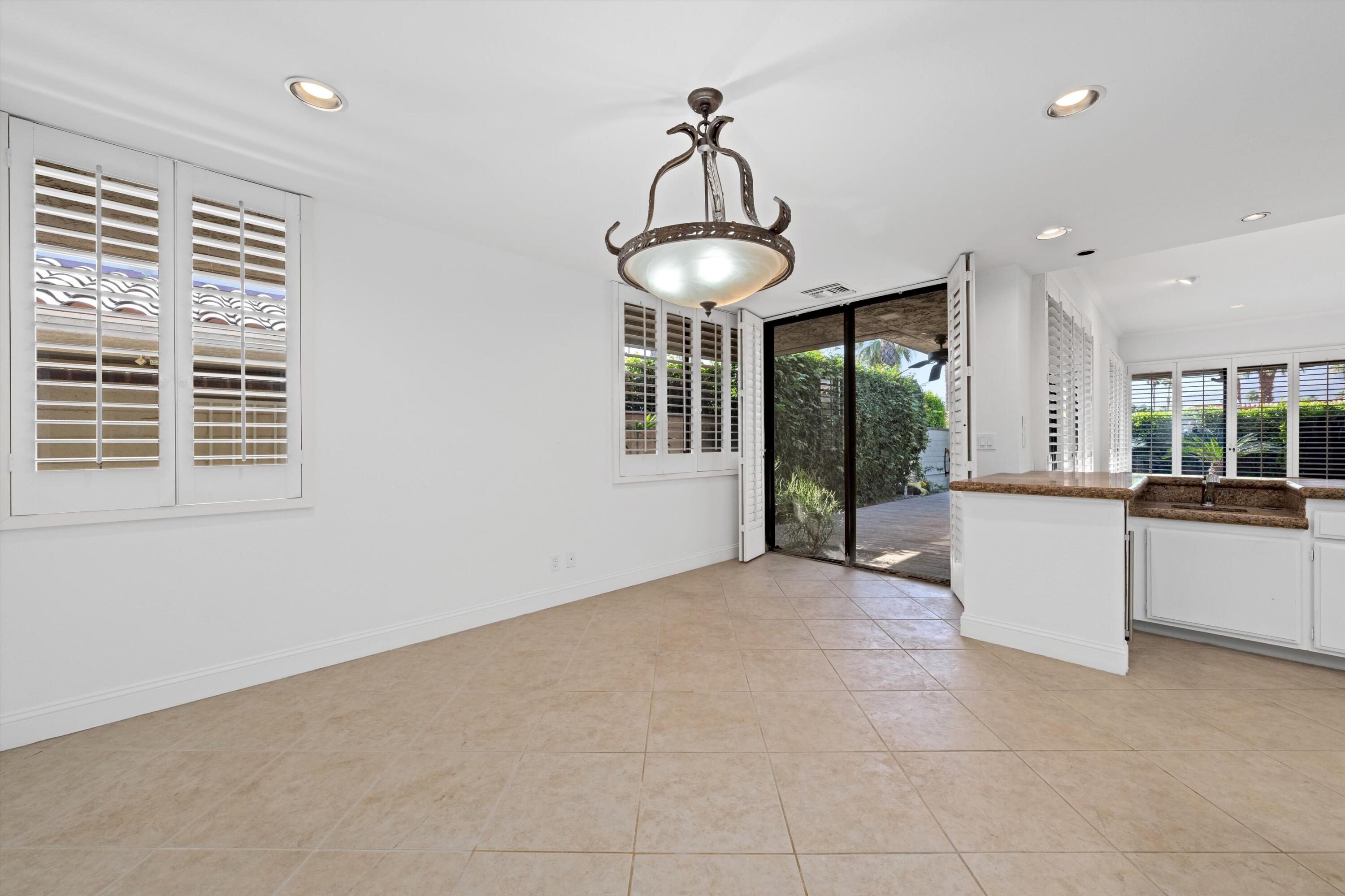 75 Colgate Drive Rancho Mirage, CA 92270 - Photo 17 of 40 a view of an empty room with a window