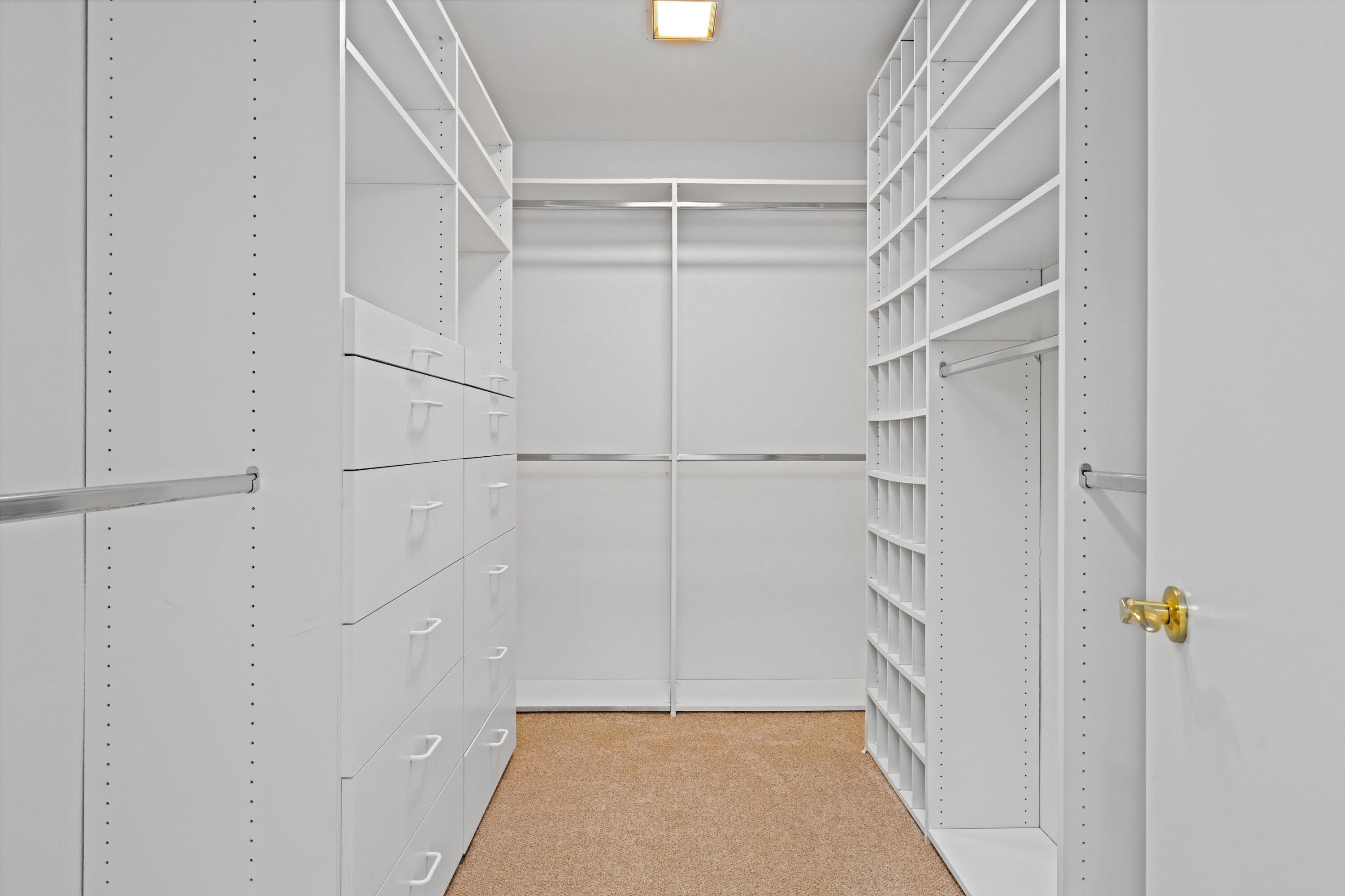 75 Colgate Drive Rancho Mirage, CA 92270 - Photo 21 of 40 a view of walk in closet with empty racks