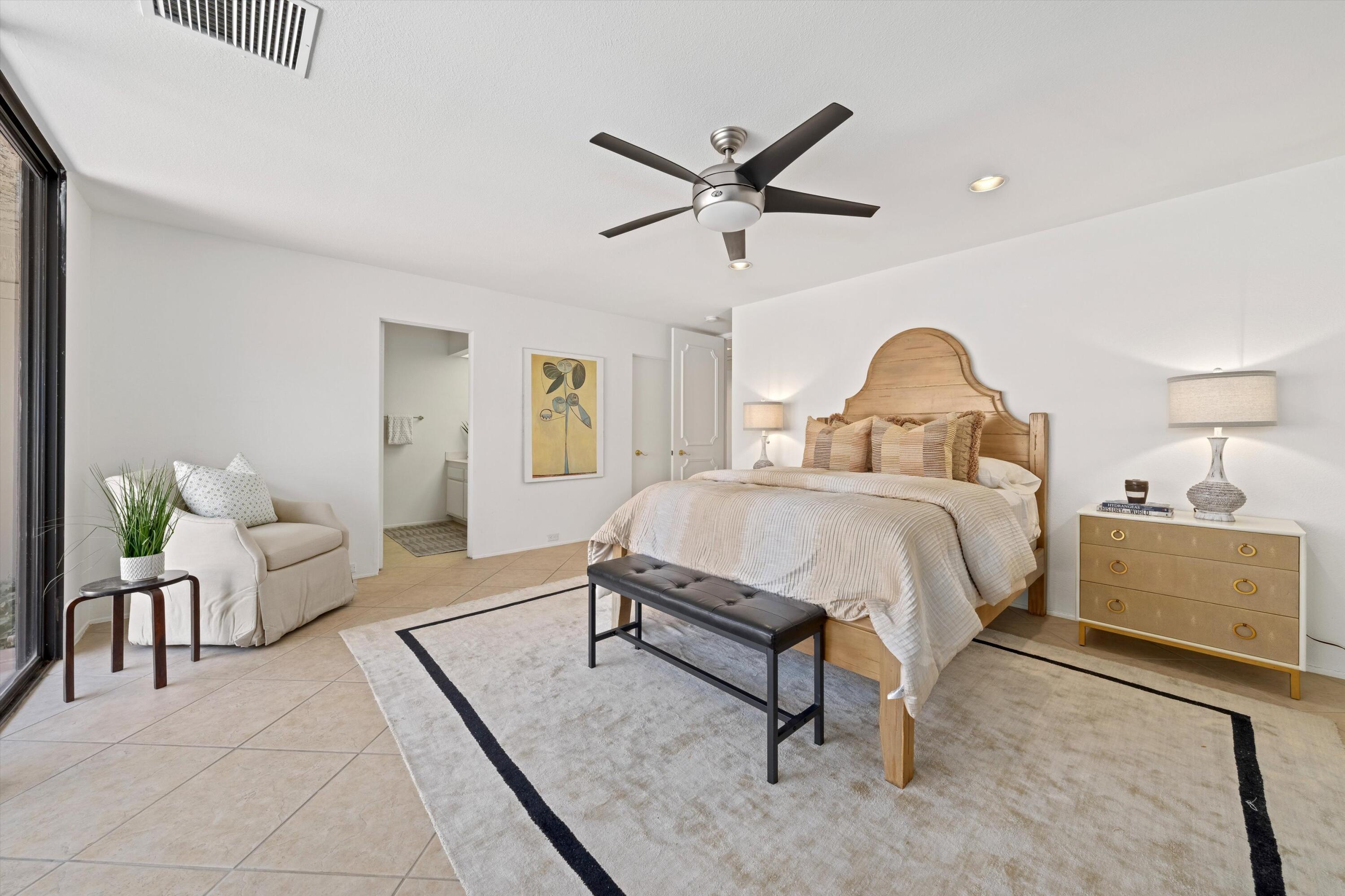 75 Colgate Drive Rancho Mirage, CA 92270 - Photo 23 of 40 a spacious bedroom with a bed and a dresser