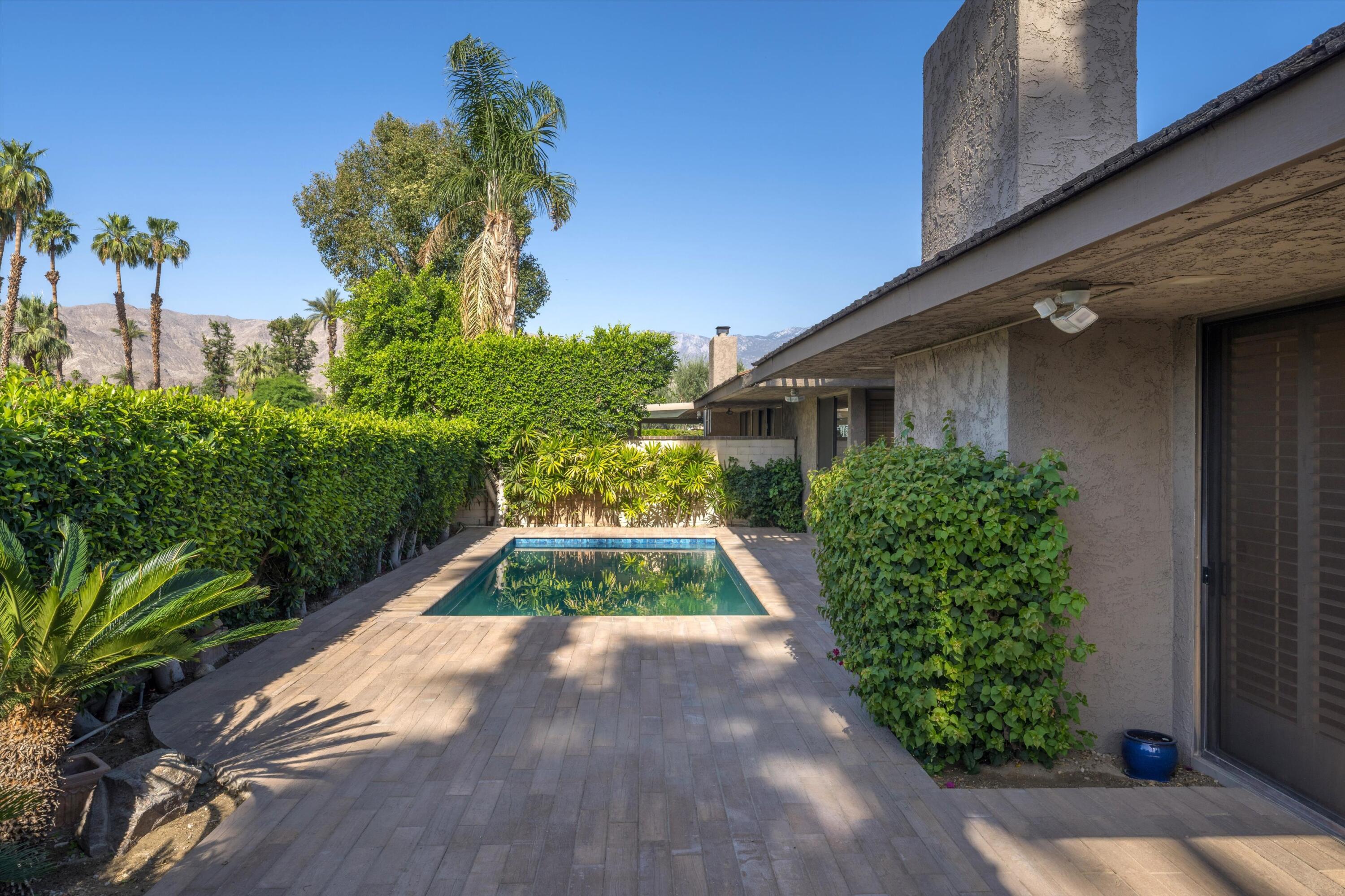 75 Colgate Drive Rancho Mirage, CA 92270 - Photo 29 of 40 a view of backyard with potted plants