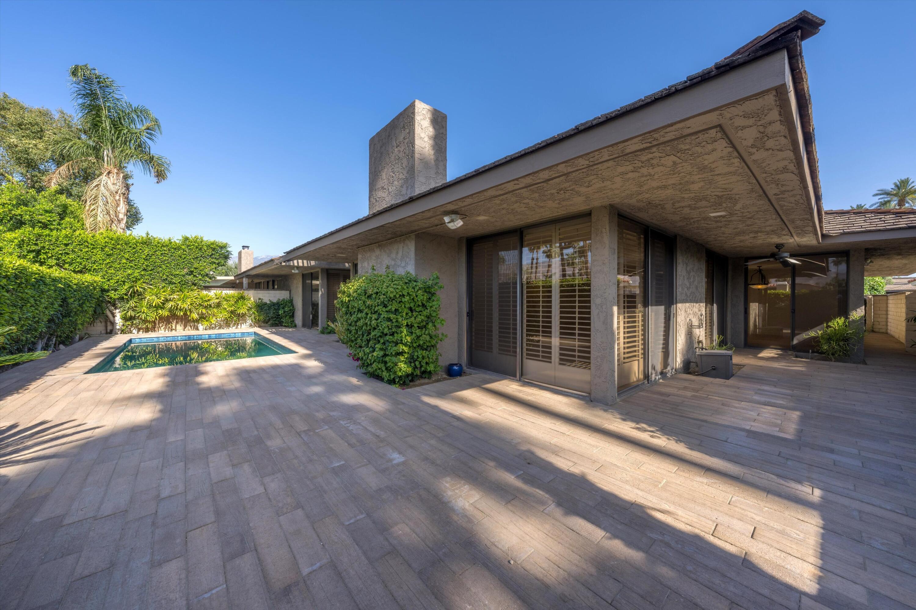 75 Colgate Drive Rancho Mirage, CA 92270 - Photo 31 of 40 a front view of a house with a yard