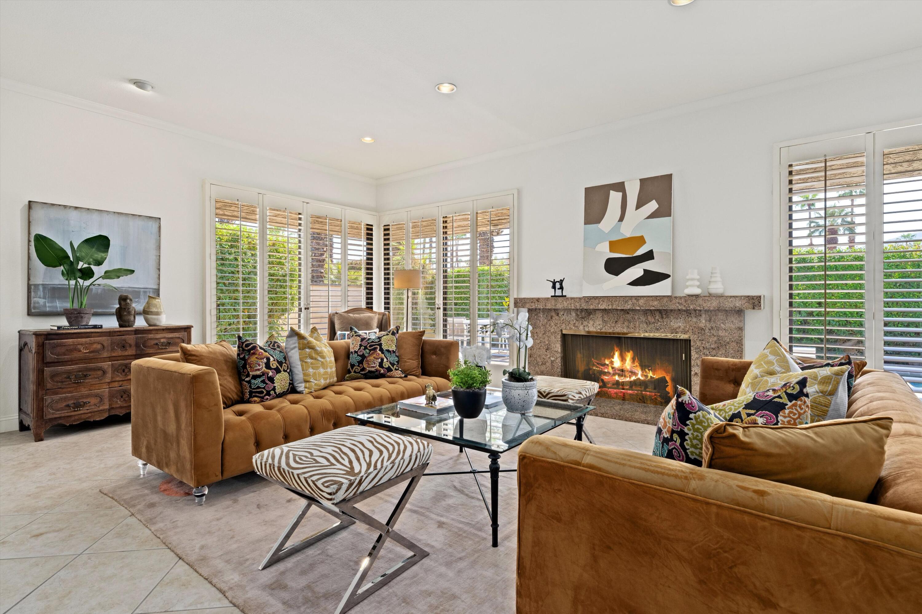75 Colgate Drive Rancho Mirage, CA 92270 - Photo 6 of 40 a living room with furniture and a fireplace