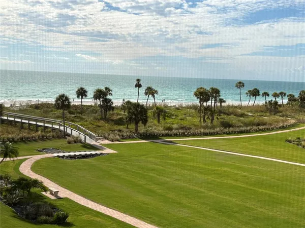 a view of a swimming pool with an ocean view