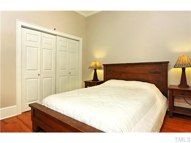 2306 Bedford Avenue Raleigh, NC 27607 - Photo 12 of 17 Second bedroom is HUGE and offers a great closet, easily 2-3x the size of what you might expect to find. There is also access to the sealed attic, also great for storage. Bedroom
