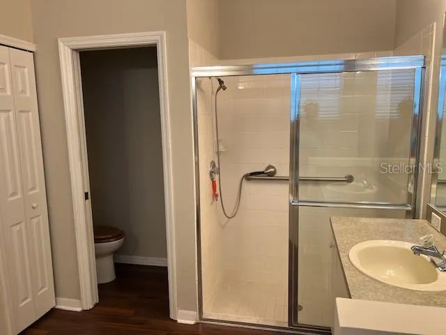 a view of lake with green space