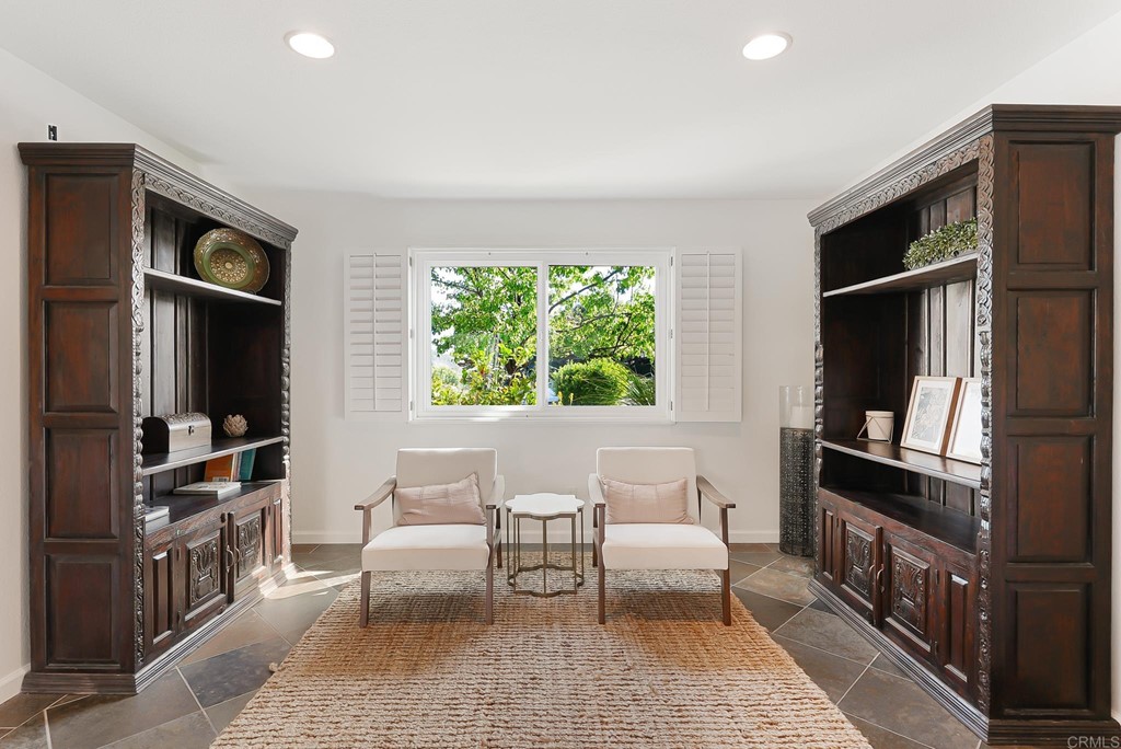 4966 Park Drive Carlsbad, CA 92008 - Photo 19 of 45 a living room with furniture a window and a flat screen tv