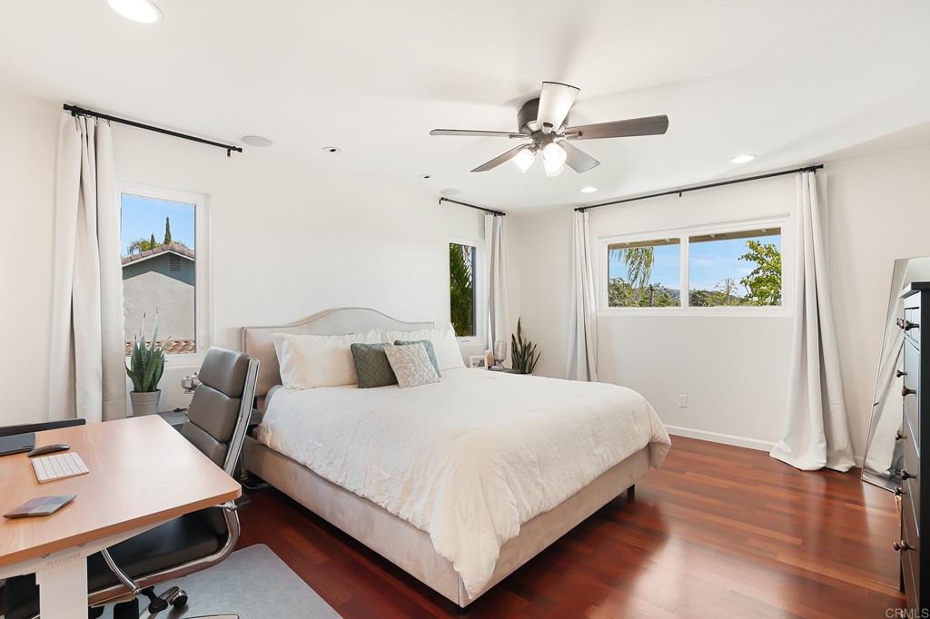 4966 Park Drive Carlsbad, CA 92008 - Photo 29 of 45 a bedroom with a bed and a chandelier