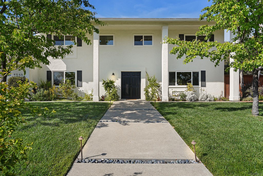 4966 Park Drive Carlsbad, CA 92008 - Photo 3 of 45 a front view of a house with garden