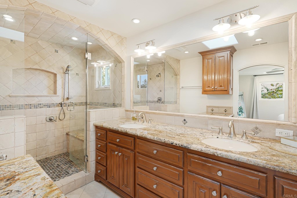 4966 Park Drive Carlsbad, CA 92008 - Photo 33 of 45 a bathroom with a granite countertop sink mirror and double