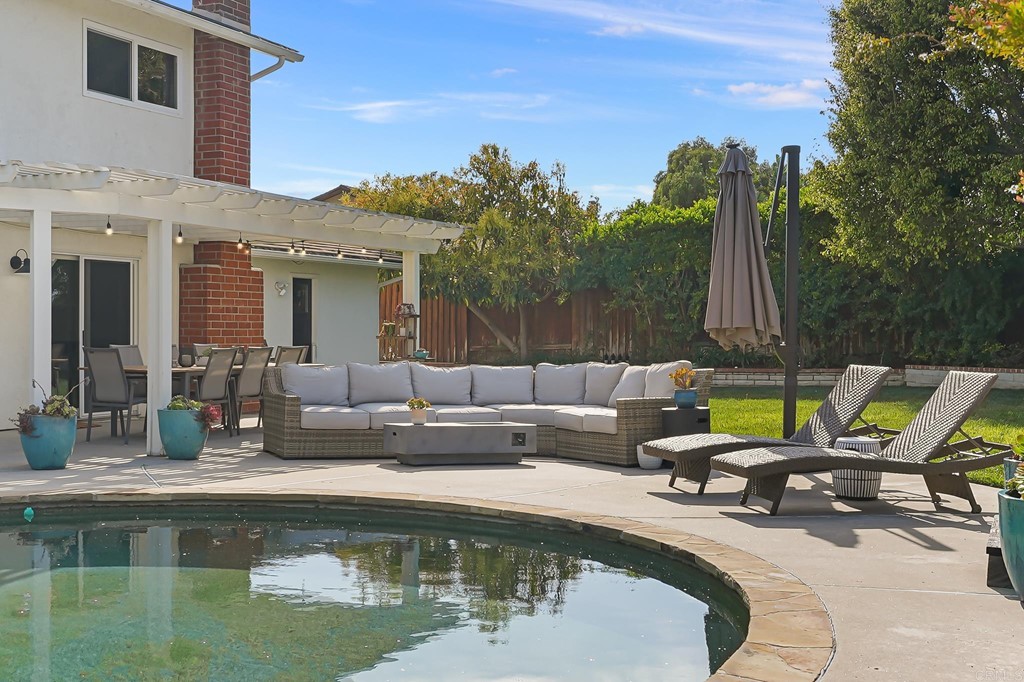 4966 Park Drive Carlsbad, CA 92008 - Photo 40 of 45 a view of a swimming pool with couches and lounge chairs