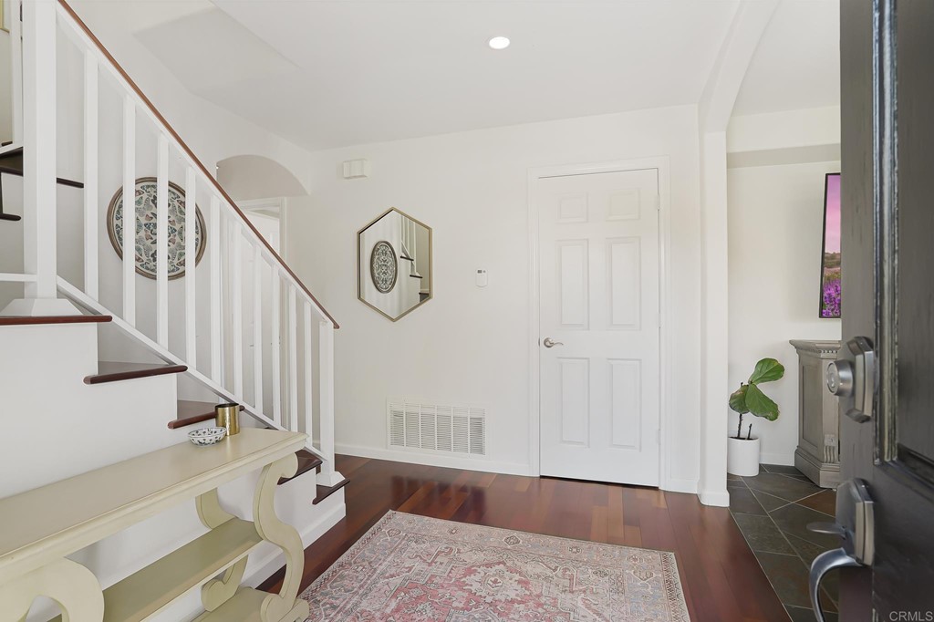 4966 Park Drive Carlsbad, CA 92008 - Photo 6 of 45 a view of entryway and hall with wooden floor