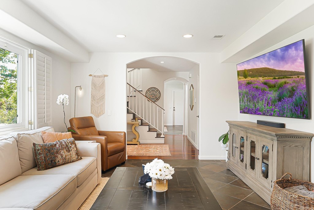 4966 Park Drive Carlsbad, CA 92008 - Photo 8 of 45 a living room with furniture and a chandelier