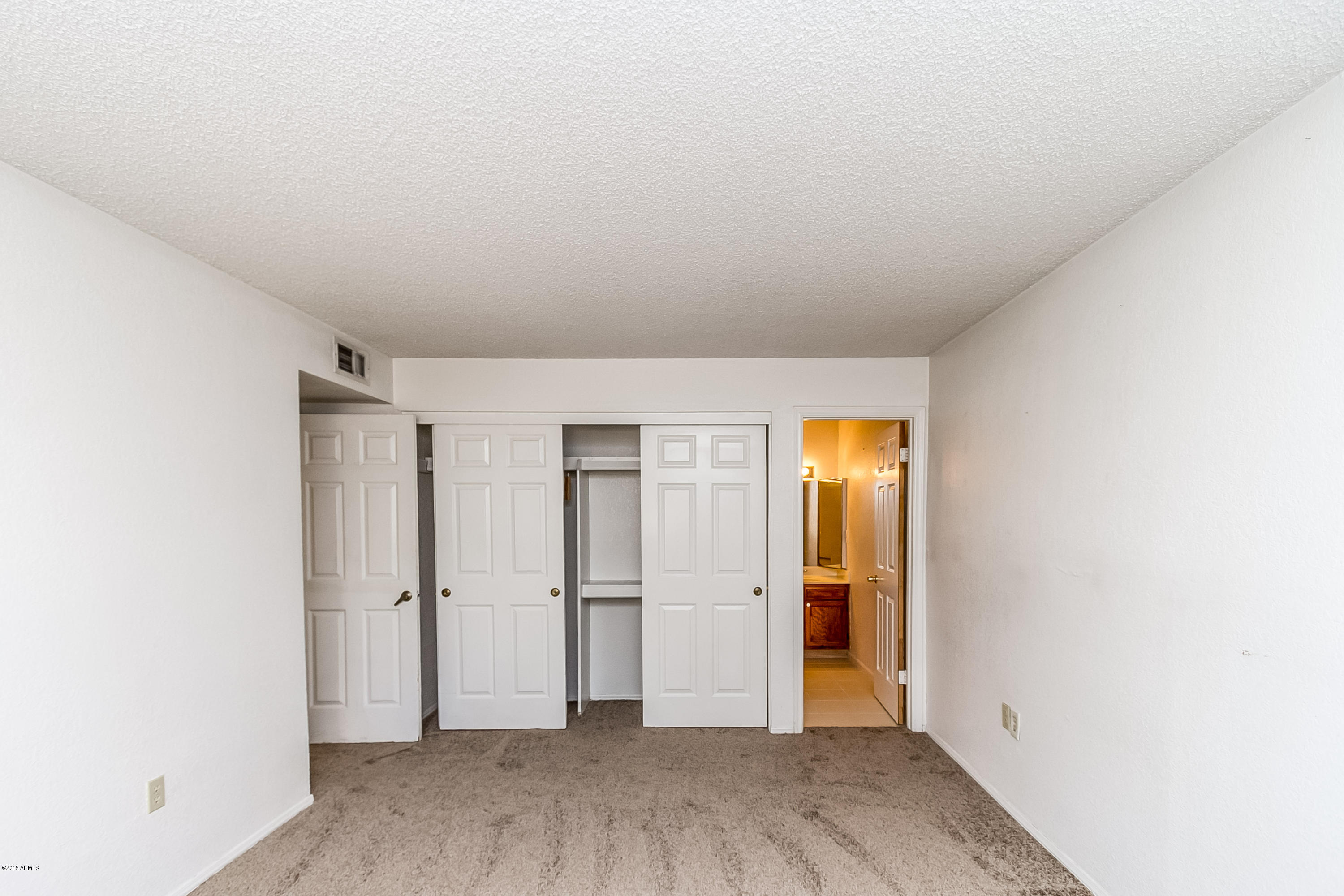 1645 West Baseline Road, Unit 1160 Mesa, AZ 85202 - Photo 19 of 27 a view of empty room with wooden floor