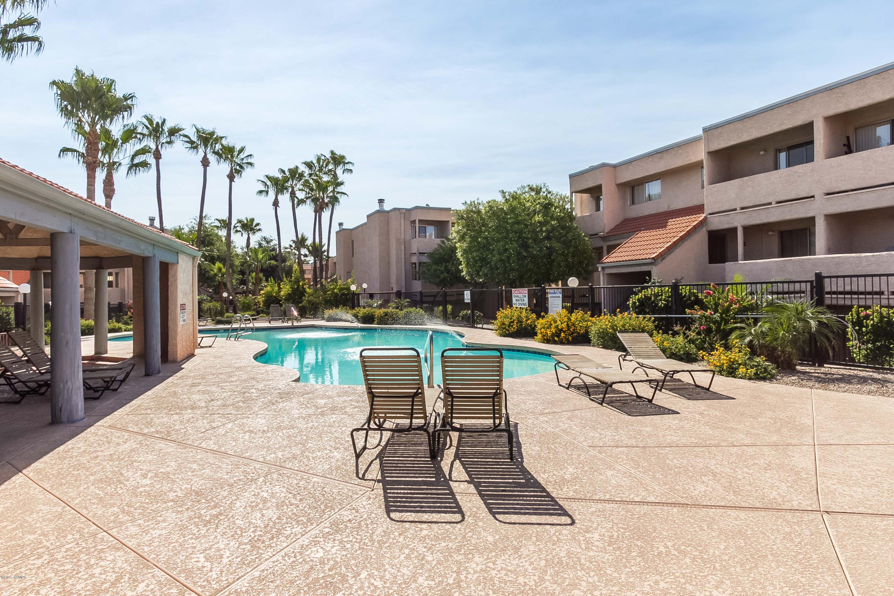 1645 West Baseline Road, Unit 1160 Mesa, AZ 85202 - Photo 27 of 27 a view of a building with garden and sitting area