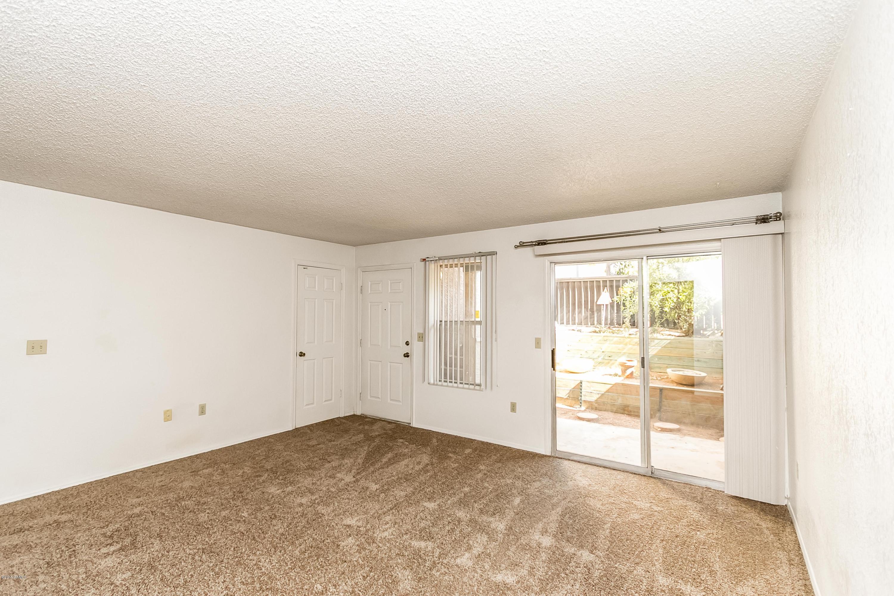 1645 West Baseline Road, Unit 1160 Mesa, AZ 85202 - Photo 5 of 27 an empty room with windows