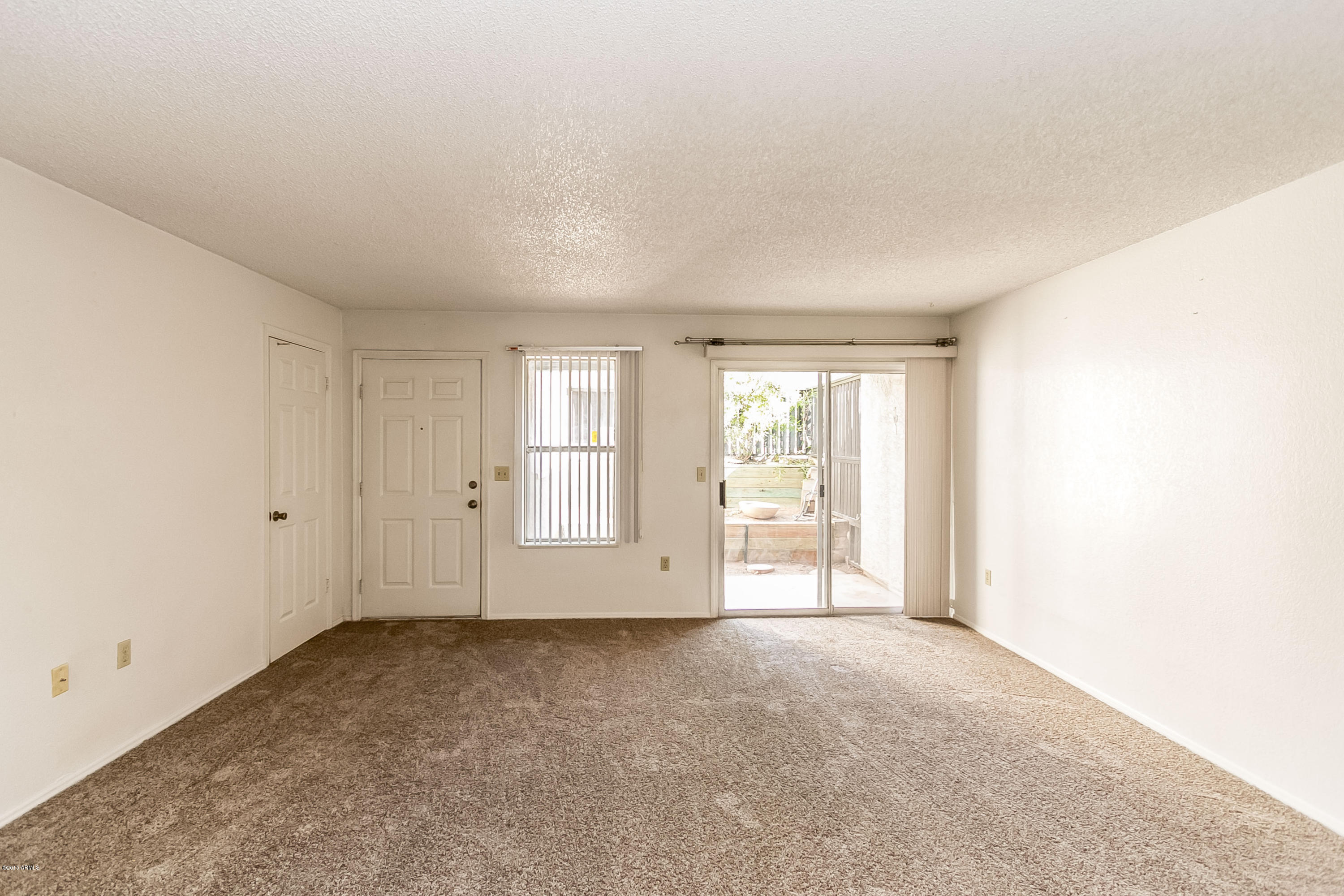 1645 West Baseline Road, Unit 1160 Mesa, AZ 85202 - Photo 6 of 27 an empty room with windows